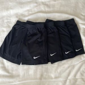 4 identical pairs of Nike shorts